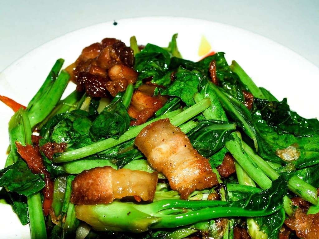 Stir-fried greens with crispy pork belly