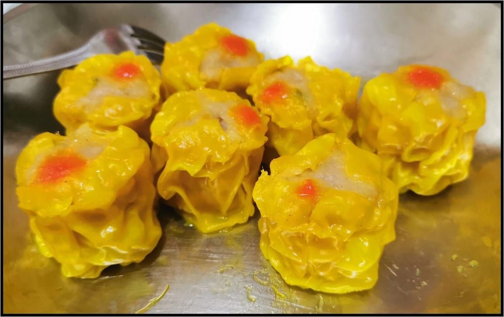 Steamed shumai dumplings on a tray